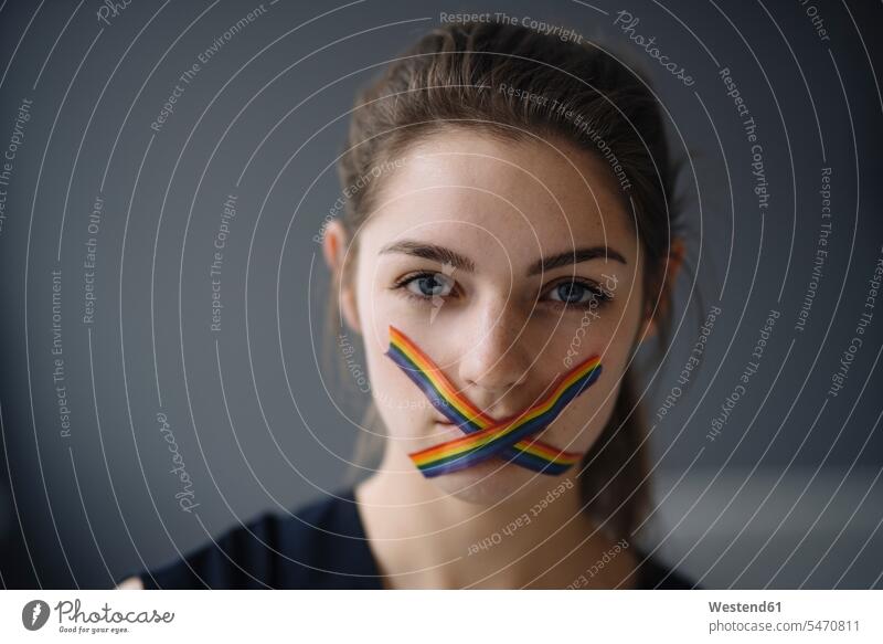 Portrait of young woman with LGBT sticky tape on her mouth human human being human beings humans person persons caucasian appearance caucasian ethnicity