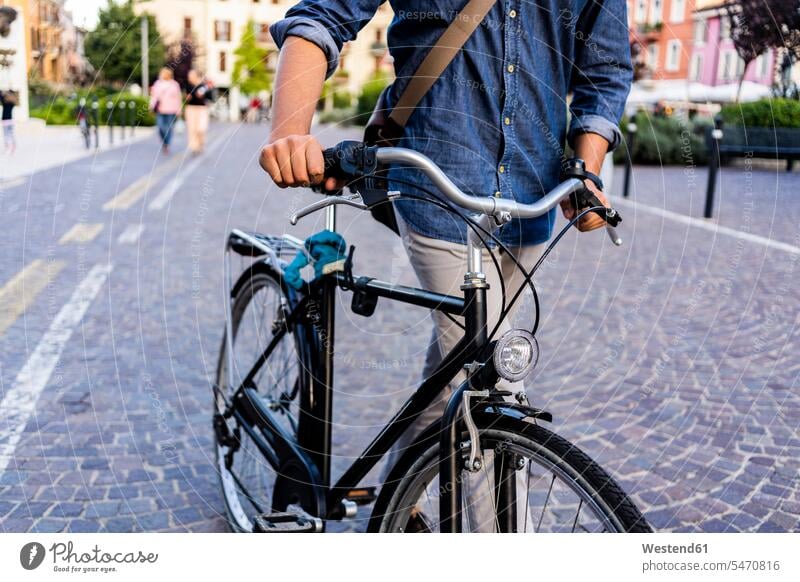 Man pushing a bicycle in the city human human being human beings humans person persons caucasian appearance caucasian ethnicity european 1 one person only