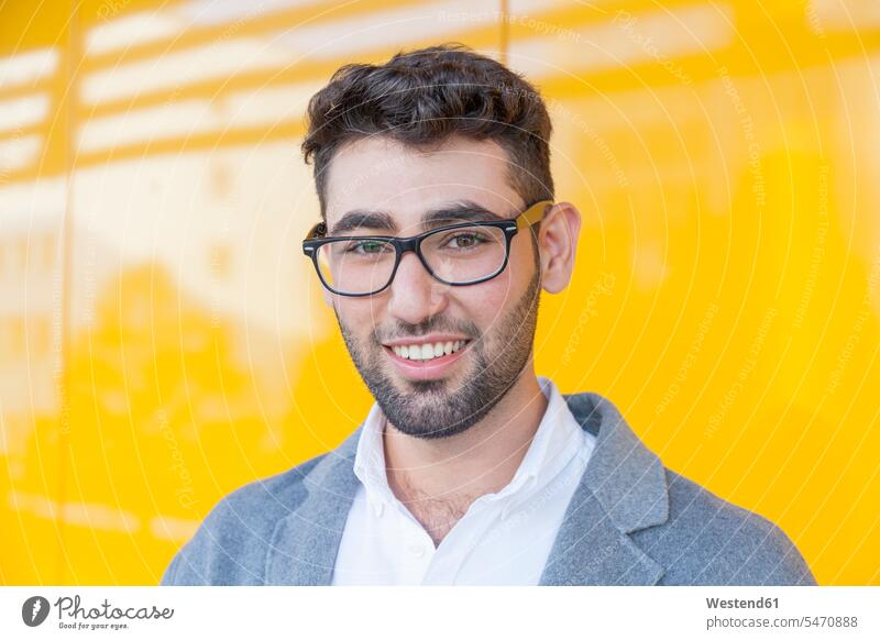 Portrait of smiling young businessman wearing glasses smile Businessman Business man Businessmen Business men portrait portraits specs Eye Glasses spectacles