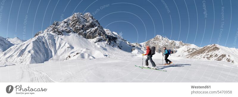 Georgia, Caucasus, Gudauri, two people on a ski tour peak mountain peak mountain peaks Traveller Travellers Travelers Recreational Pursuit