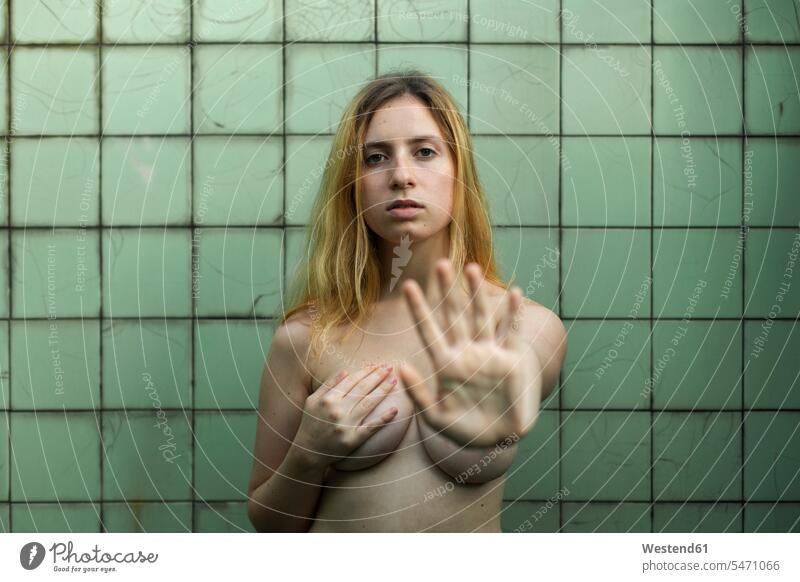 Nude woman showing emotions in bathroom, feminism, abuse and violence against women victim victims Violation Rape gesture gesturing defence defense defending