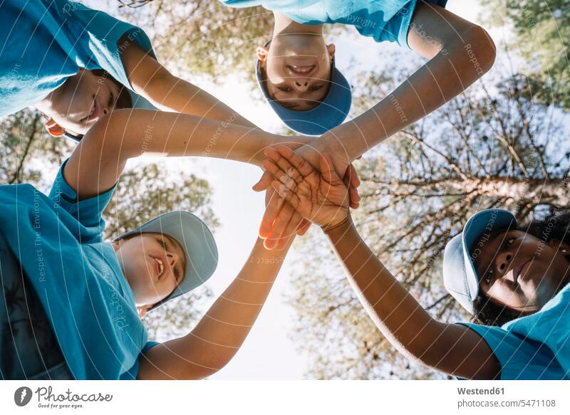 Group of kids stacking hands human human being human beings humans person persons caucasian appearance caucasian ethnicity european North African