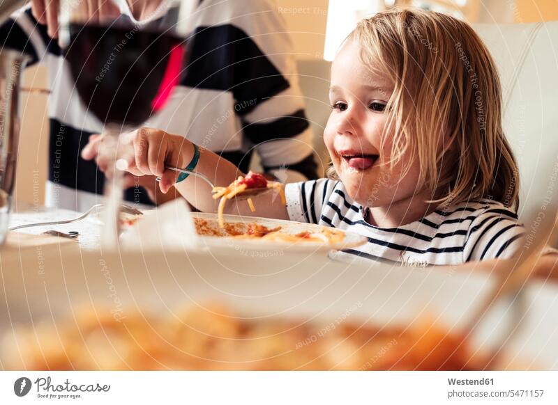 Portrait of happy little girl eating Spaghetti human human being human beings humans person persons caucasian appearance caucasian ethnicity european 2 2 people