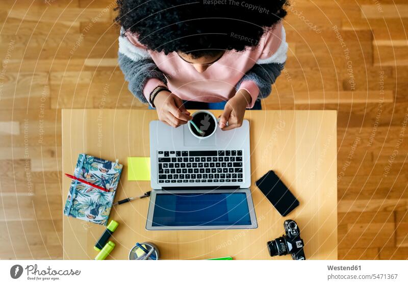 Top view of young woman working from home using laptop human human being human beings humans person persons celibate celibates singles solitary people