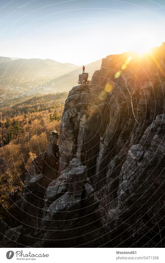 Man standing on rock needle at sunset at Battert rock, Baden-Baden, Germany (value=0) human human being human beings humans person persons caucasian appearance