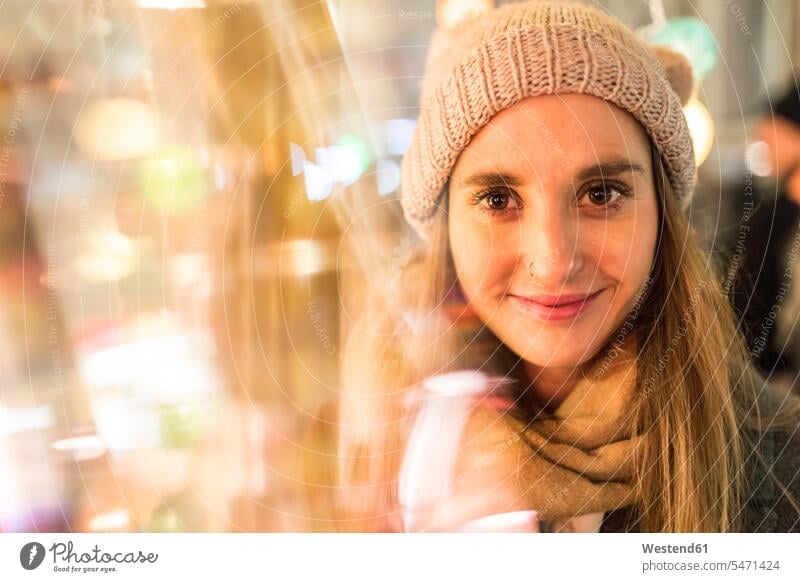 Portrait of smiling young woman at Christmas market smile females women portrait portraits Event Events Adults grown-ups grownups adult people persons