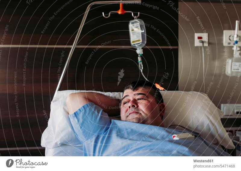 Patient lying in hospital bed human human being human beings humans person persons caucasian appearance caucasian ethnicity european 1 one person only