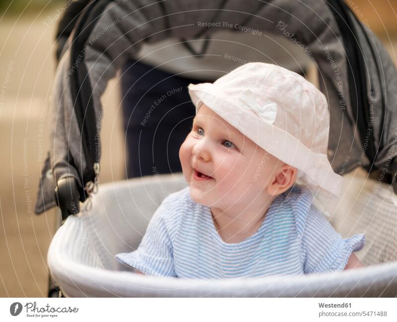 Portrait of relaxed baby girl in pram baby girls female portrait portraits infants nurselings babies smiling smile relaxation people persons human being humans