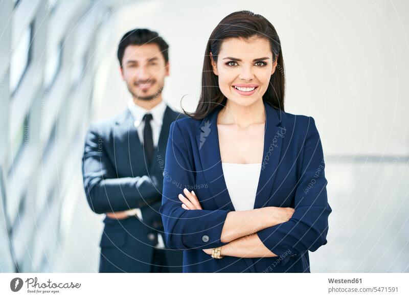 Portrait of smiling businesswoman and businessman portrait portraits Businessman Business man Businessmen Business men smile businesswomen business woman