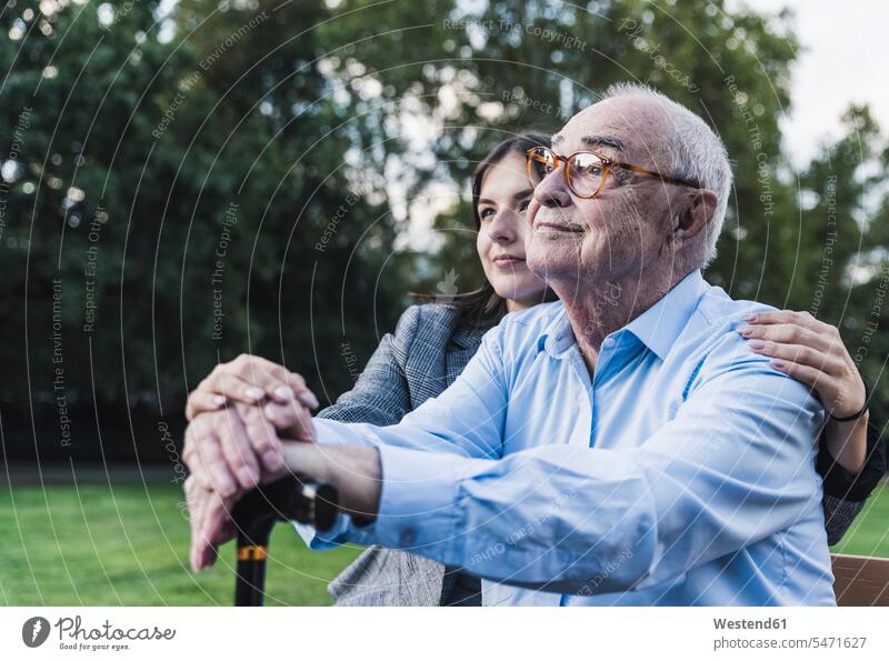 Portrait of senior man with his granddaughter in a park generation touch relax relaxing Emotions Feeling Feelings Sentiment Sentiments loving closeness