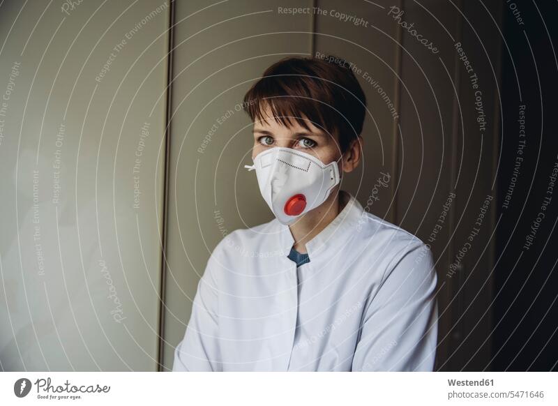 Female doctor wearing FFP3 mask health healthcare Healthcare And Medicines medical medicine stethoscopes disease diseases ill illnesses sick Sickness healthy
