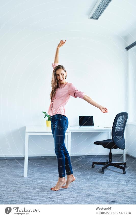 Cheerful young woman standing in office Occupation Work job jobs profession professional occupation business life business world business person businesspeople