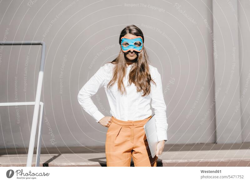 Woman with mask holding digital tablet Mixed Race Person mixed-race Person mixed race ethnicity Authority power woman woman of power powerful woman attitude