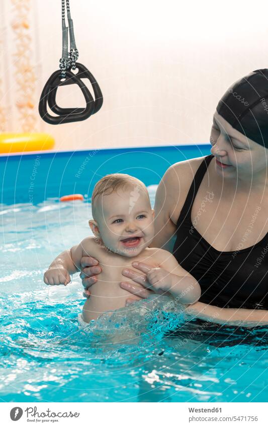 Baby swimming, mother with daughter in swimming pool Fun having fun funny water Baby Swimming laughing Laughter baby infants nurselings babies daughters mommy