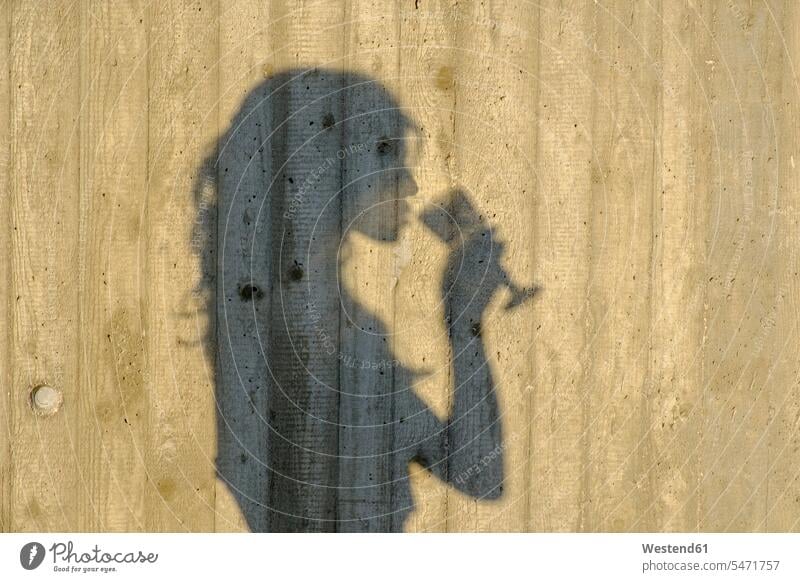 Shadow of teenage girl drinking glass of wine text space human human being human beings humans person persons Teen Teenage teenagers Teens female