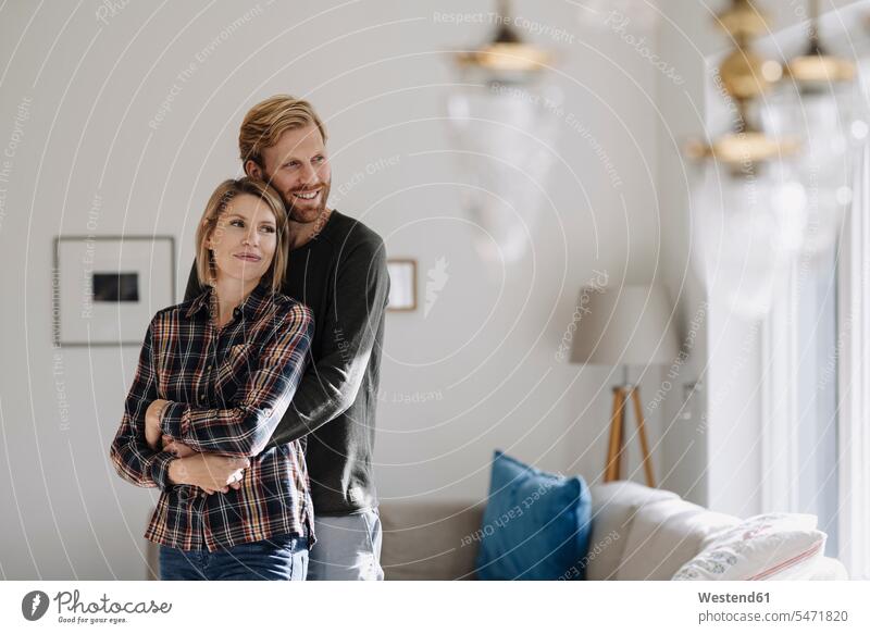 Couple embracing at home human human being human beings humans person persons caucasian appearance caucasian ethnicity european 2 2 people 2 persons two