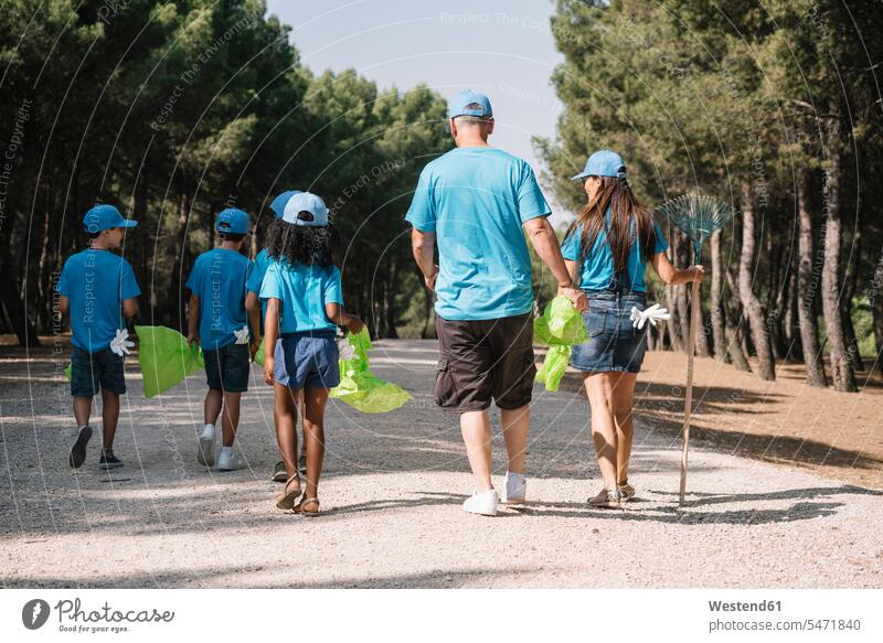 Group of volunteers collecting garbage in a park human human being human beings humans person persons caucasian appearance caucasian ethnicity european