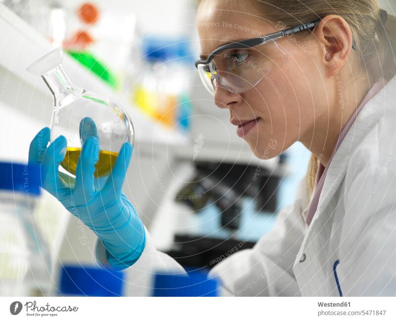 Scientist preparing a chemical formula in the laboratory female natural scientist female natural scientists laboratory technician chemical research