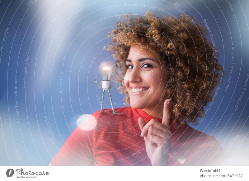 Portrait of smart woman with lightbulb on her shoulder human human being human beings humans person persons caucasian appearance caucasian ethnicity european 1