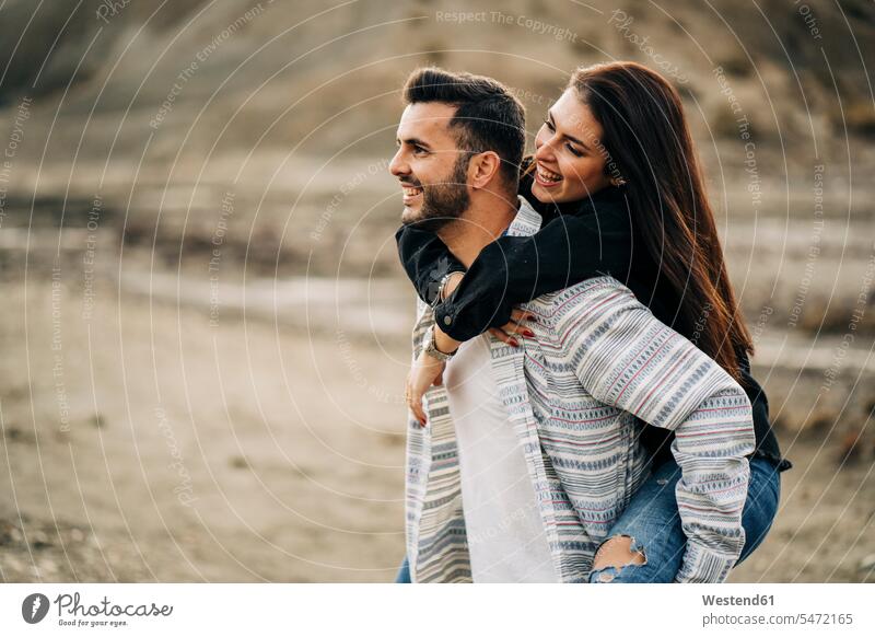 Cheerful young couple in desert landscape, Almeria, Andalusia, Spain human human being human beings humans person persons caucasian appearance