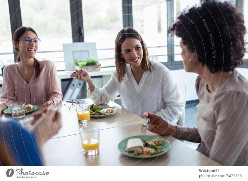 Businesswomen during lunch in an office Occupation Work job jobs profession professional occupation business life business world business person businesspeople
