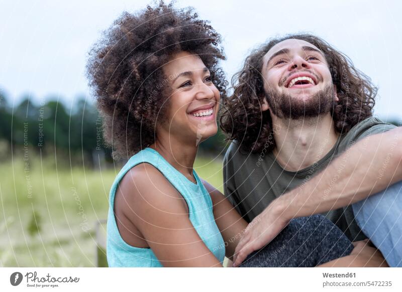 Laughing couple outdoors twosomes partnership couples smiling smile happiness happy people persons human being humans human beings joyful lust for life