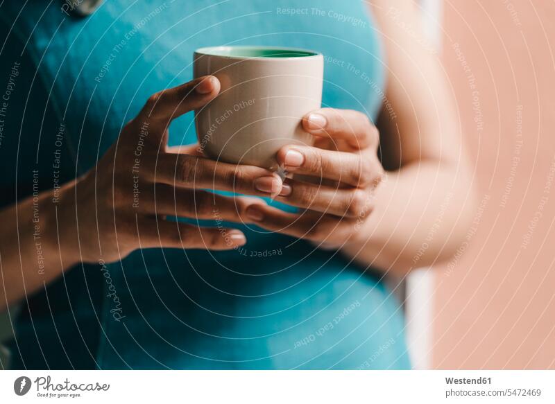 Woman holding cup of coffee, close up Coffee woman females women Coffee Cup Coffee Cups hand human hand hands human hands drinking Drink beverages Drinks
