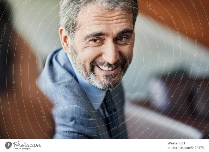 Portrait of a smiling businessman looking at colleague human human being human beings humans person persons caucasian appearance caucasian ethnicity european