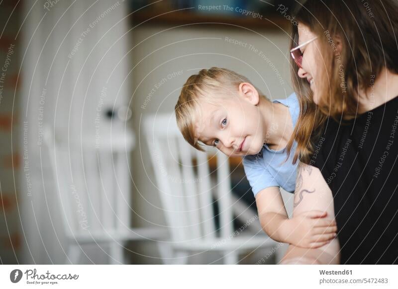 Portrait of little boy on his mother's arms at home human human being human beings humans person persons families mama mom mommy mothers mummy hold smile relax