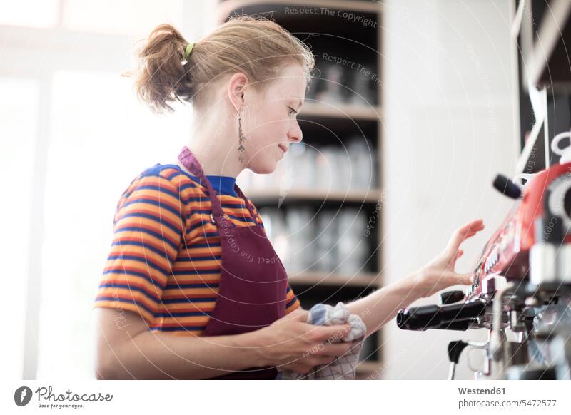 Woman with apron working in a cafe human human being human beings humans person persons caucasian appearance caucasian ethnicity european 1 one person only