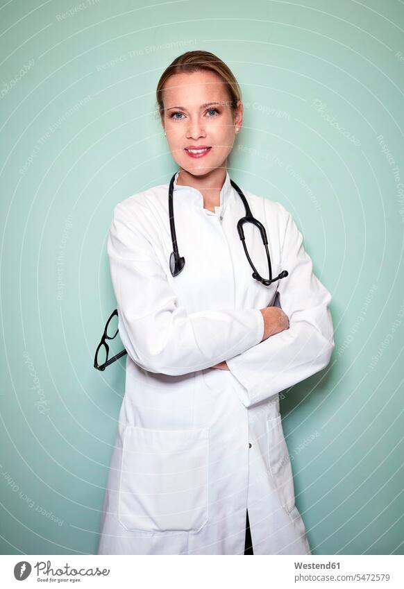 Portrait of confident female doctor with stethoscope woman females women portrait portraits Female Doctor physicians Female Doctors confidence Adults grown-ups