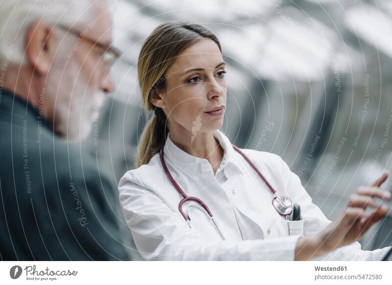 Portrait of female doctor with senior patient health healthcare Healthcare And Medicines medical medicine disease diseases ill illnesses sick Sickness patients