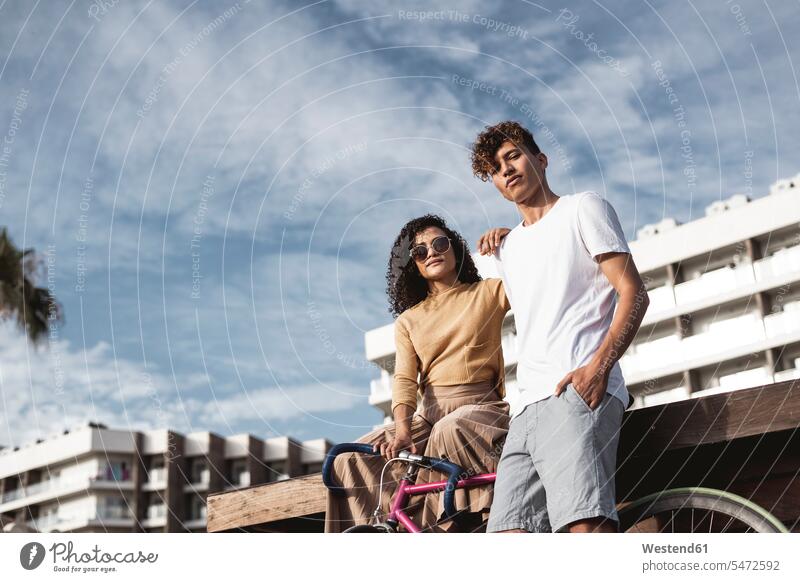 Cool couple with bicycle in the city human human being human beings humans person persons Mixed Race mixed race ethnicity mixed-race Person 2 2 people 2 persons