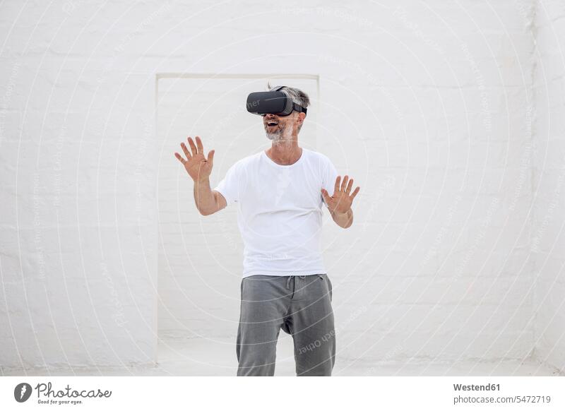 Mature man discovering empty space with VR goggles human human being human beings humans person persons caucasian appearance caucasian ethnicity european 1