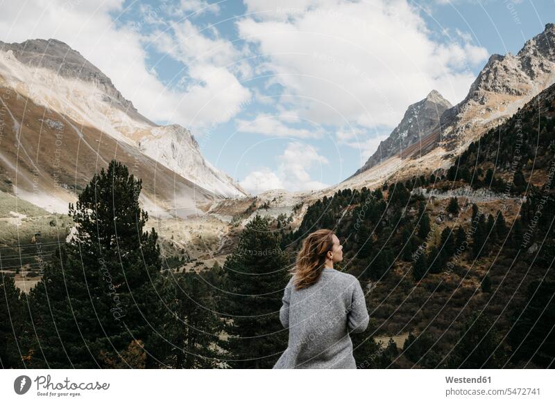 Switzerland, Grisons, Albula Pass, woman standing in mountainscape mountain range mountain ranges females women mountainscapes mountain scenery