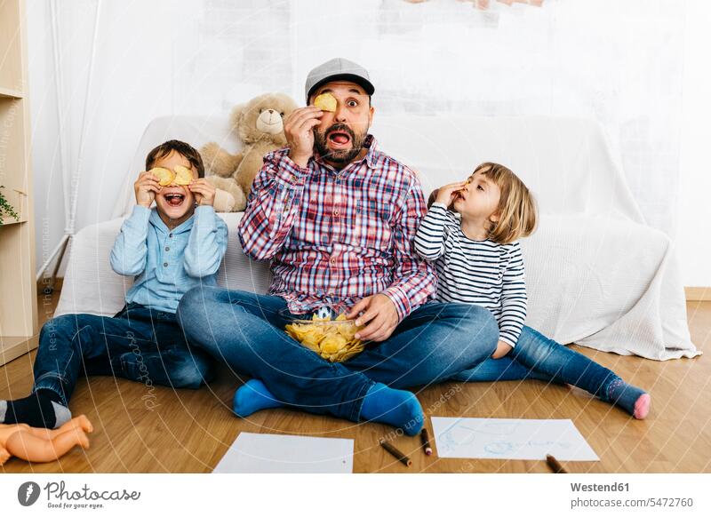 Fahther and children sitting on floor, covering eyes with potatoe chips images picture pictures drawings Child's Drawings children's drawing Childs Drawing