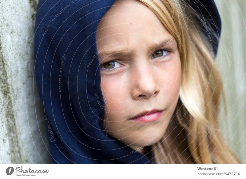Portrait of unhappy blond girl dissatisfied displeased unlucky females girls blond hair blonde hair portrait portraits child children kid kids people persons