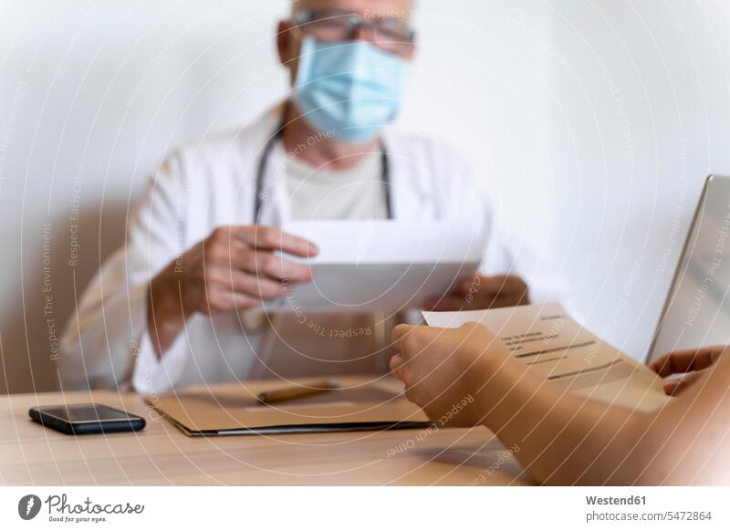 Doctor giving medical reports to patient color image colour image indoors indoor shot indoor shots interior interior view Interiors day daylight shot