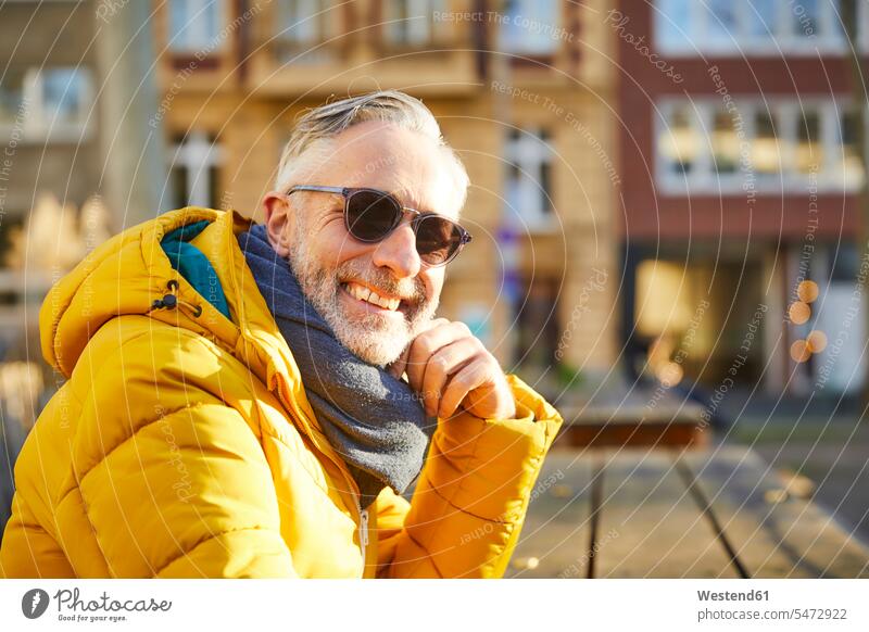 Portrait of smiling mature man wearing sunglasses in the city human human being human beings humans person persons celibate celibates singles solitary people