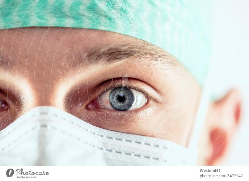 Surgeon with blue eyes, close-up doctor physicians doctors surgeon healthcare and medicine medical Healthcare And Medicines operating room operating rooms mask