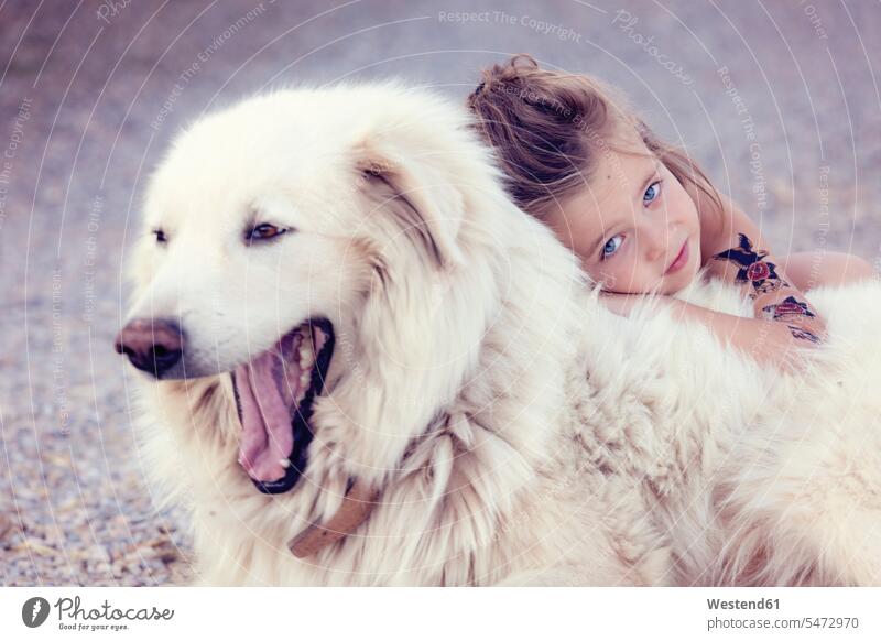 Portrait of little girl cuddling yawning white dog animals creature creatures pet Canine dogs cuddle snuggle snuggling seasons summer time summertime summery