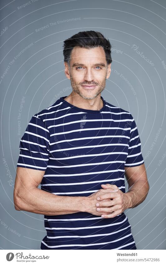Portrait of man with stubble wearing striped t-shirt tee-shirt T- Shirt t-shirts men males stripes Unshaven portrait portraits Adults grown-ups grownups adult