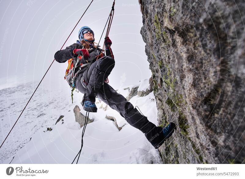 Mature woman climbing at Grossvendediger, Tyrol, Austria ropes chilly Cold Temperature Cold Weather free time leisure time Recreational Activities