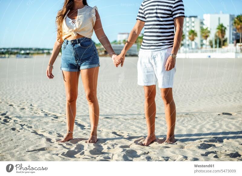 Close-up of couple holding hands on the beach beaches twosomes partnership couples people persons human being humans human beings El Puerto de Santa Maria