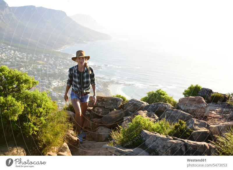 South Africa, Cape Town, woman on hiking trip to Lion's Head hike walking going hiking tour walking tour View Vista Look-Out outlook sea ocean females women