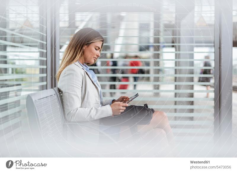 Young businesswoman using tablet in a waiting area human human being human beings humans person persons caucasian appearance caucasian ethnicity european 1