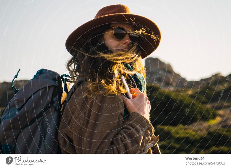 Italy, Sardinia, portrait of woman on a hiking trip portraits hiking tour walking tour females women hike excursion Getaway Trip Tours Trips Travel Adults