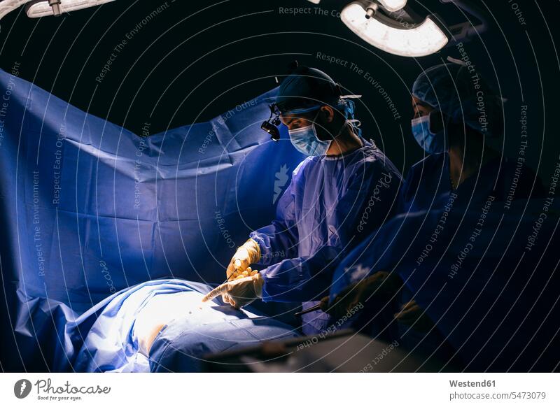 Operating room team during an operation human human being human beings humans person persons caucasian appearance caucasian ethnicity european Group