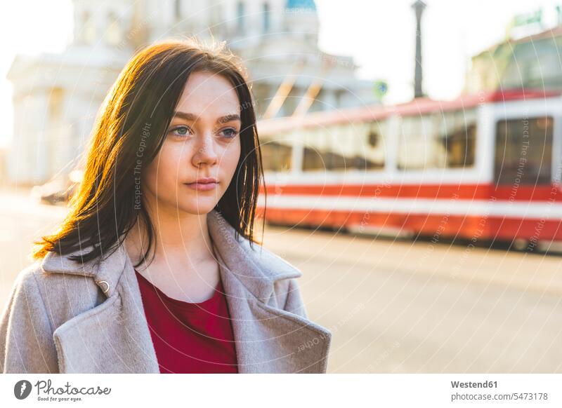 Russia, St. Petersburg, portrait of young woman in the city evening light portraits waiting tramway tramways streetcars trams City Break City Trip Urban Tourism