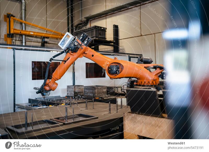 Industrial robots welding in industry color image colour image indoors indoor shot indoor shots interior interior view Interiors Automated automatized robot arm